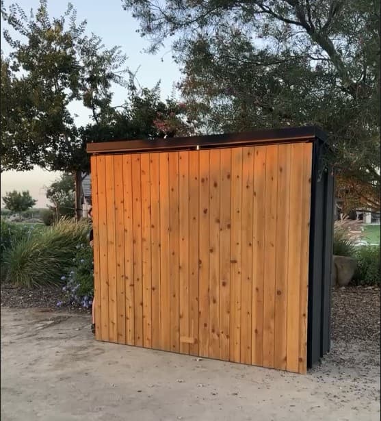 Prefab outdoor kitchen pod closed, showing the vertical cedar slat front
