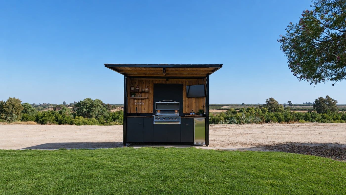 Enclosed outdoor kitchen pod open from the front, showing the Blaze grill, sink and stainless fridge